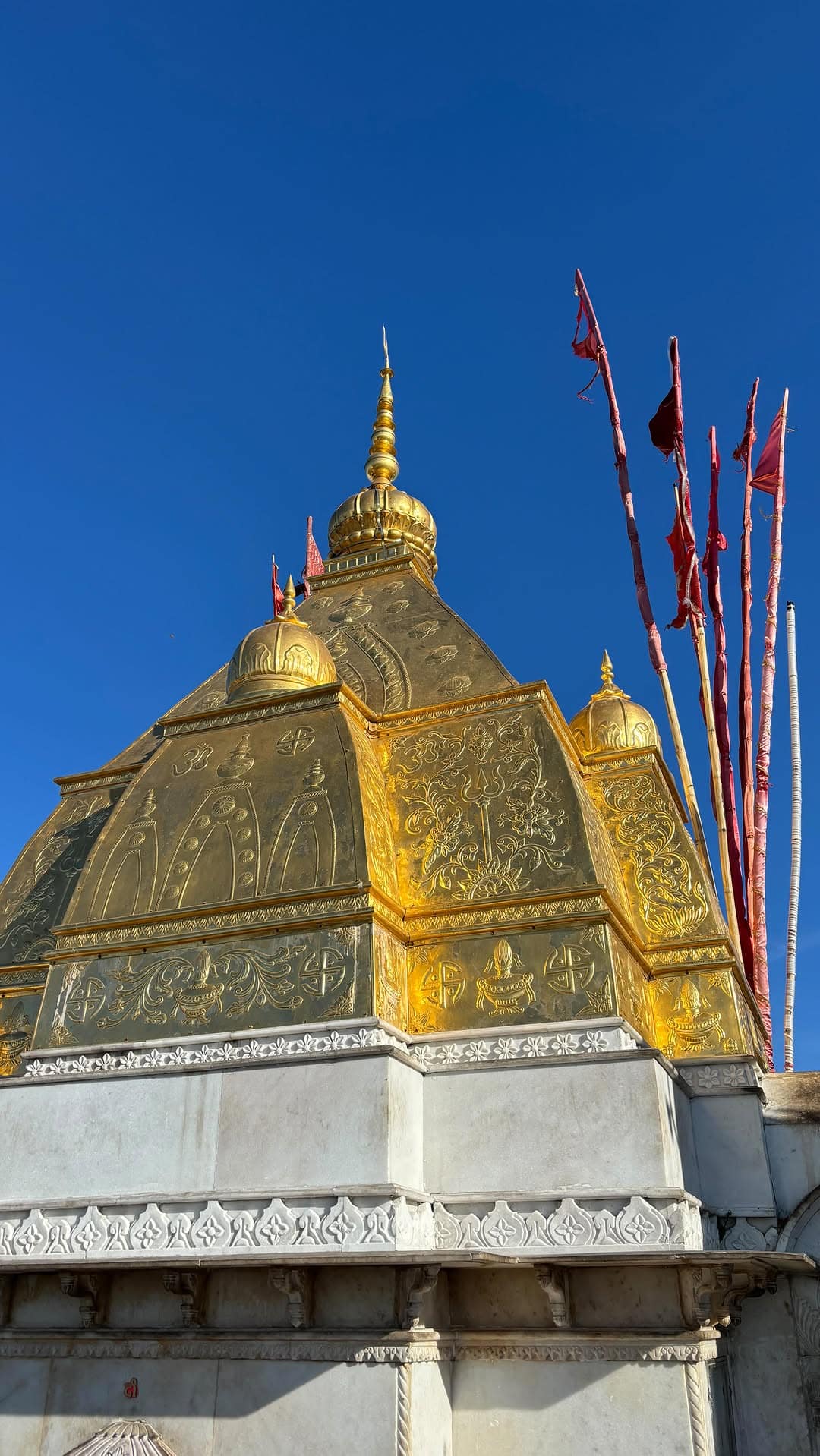 Snow-covered Himalayan peaks under a clear morning sky